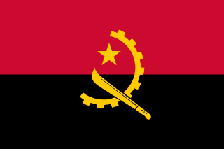 The flag of Angola features two equal horizontal bands of red and black, with a yellow emblem at its centre. This emblem consists of a five-pointed star within the hoist-side facing half of a cogwheel that is crossed on its lower end by a machete.