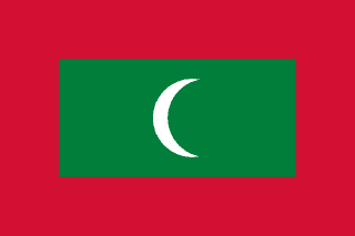 The flag of Maldives has a red field, at the center of which is a large green rectangle bearing a fly-side facing white crescent.